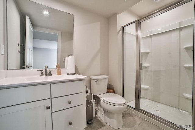 full bath featuring a shower stall, toilet, and vanity
