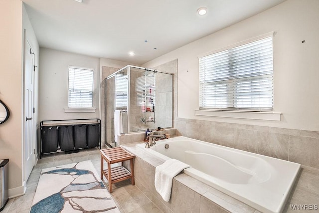full bath with tile patterned floors, a garden tub, recessed lighting, and a stall shower