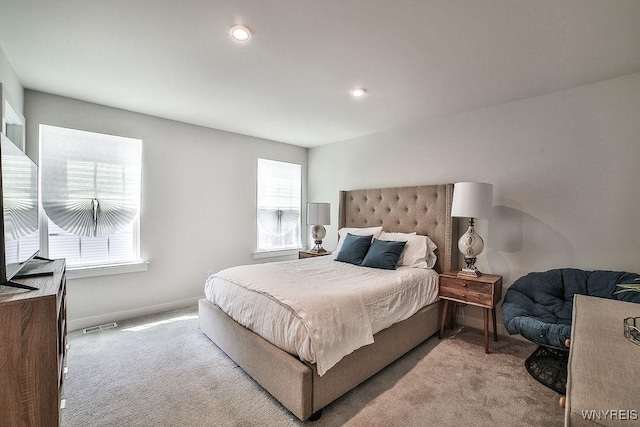 carpeted bedroom featuring recessed lighting and baseboards