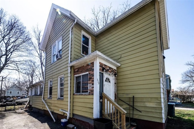 rear view of property with entry steps