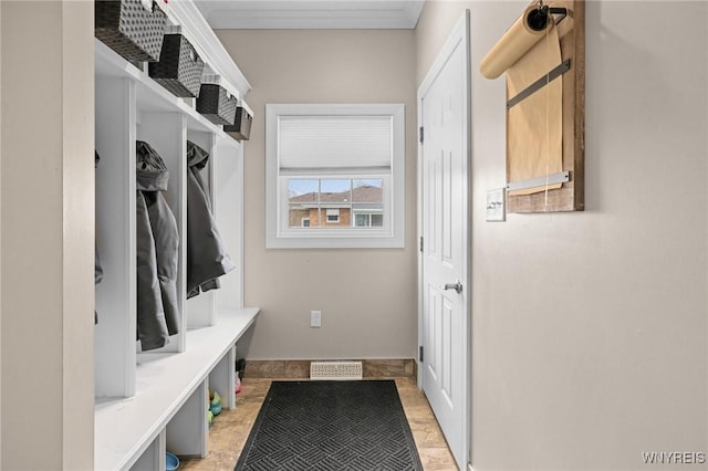 mudroom with visible vents and crown molding