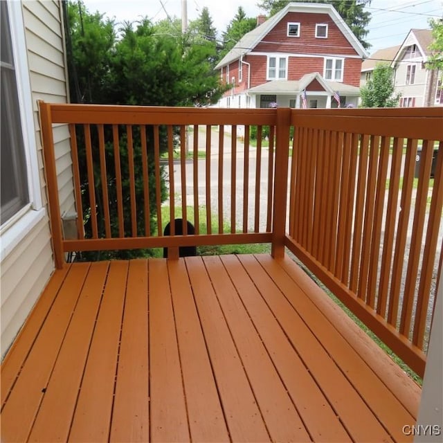 wooden terrace featuring a residential view