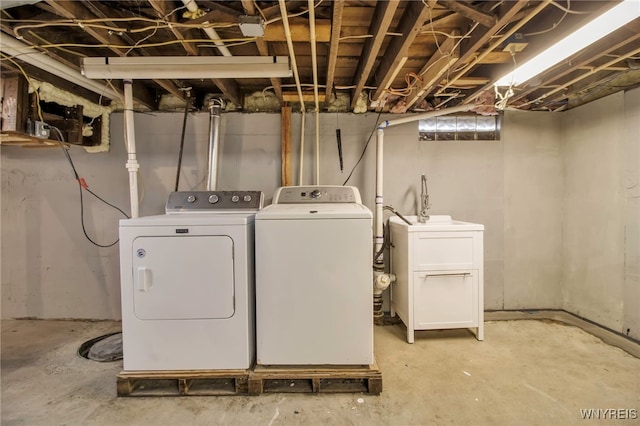 laundry area with separate washer and dryer and laundry area