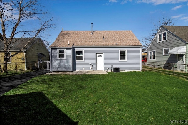 back of property with a gate, roof with shingles, a lawn, central AC, and a fenced backyard