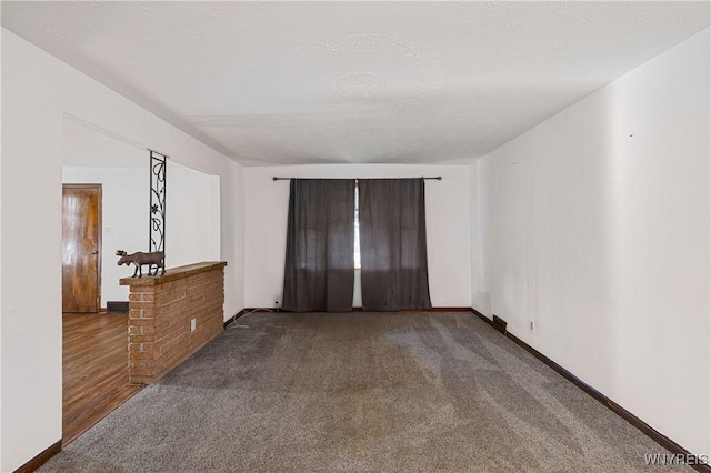 unfurnished bedroom with baseboards and carpet