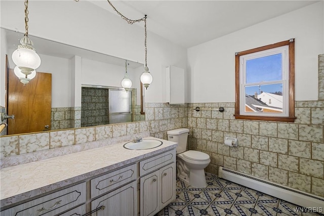 bathroom with toilet, tile walls, baseboard heating, and tile patterned floors