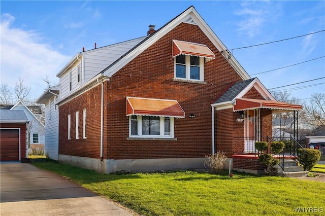 view of front of house featuring an outbuilding, a front yard, a chimney, and brick siding