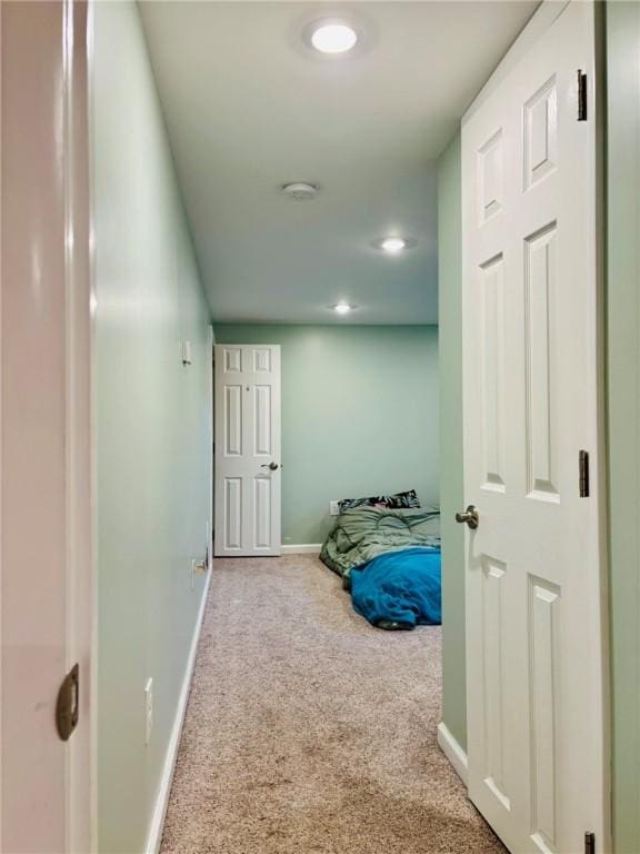 hall featuring recessed lighting, carpet flooring, and baseboards