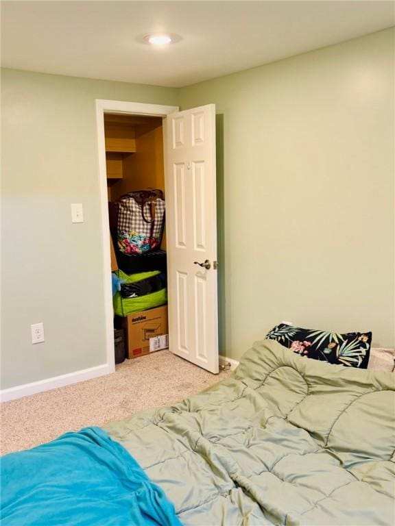 carpeted bedroom with baseboards