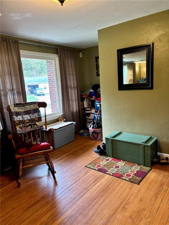 sitting room featuring hardwood / wood-style flooring