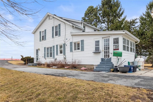 2481 County Road 20, Phelps, NY 14432 - view of front facade with entry steps, a front lawn, and driveway