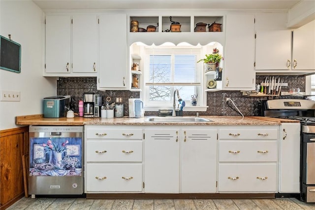 kitchen with open shelves, appliances with stainless steel finishes, white cabinets, backsplash, and a sink