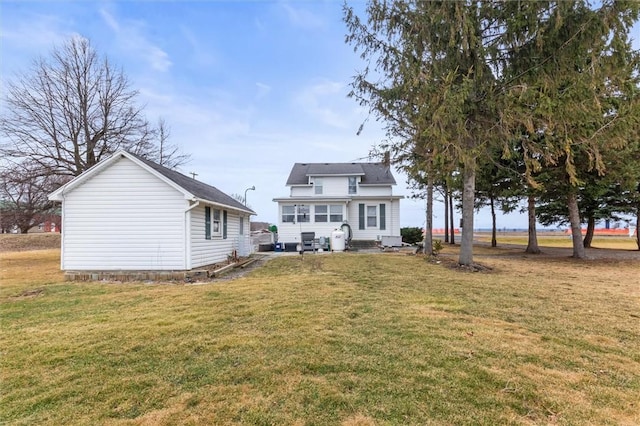 2481 County Road 20, Phelps, NY 14432 - rear view of house with a yard
