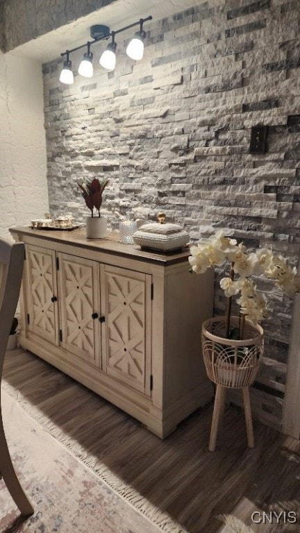 bar with dark wood-style flooring