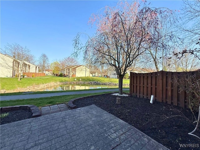 view of yard featuring fence and a patio