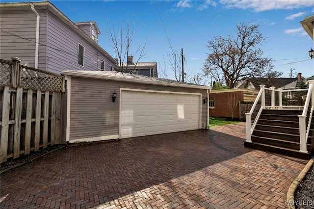 garage featuring fence