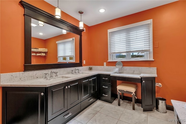 bathroom featuring tile patterned flooring and vanity