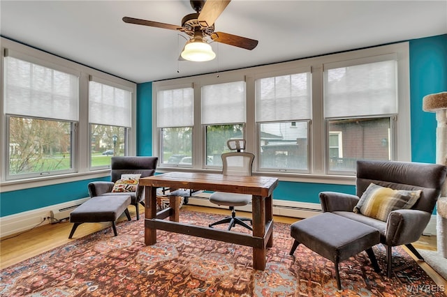 office with a ceiling fan and wood finished floors