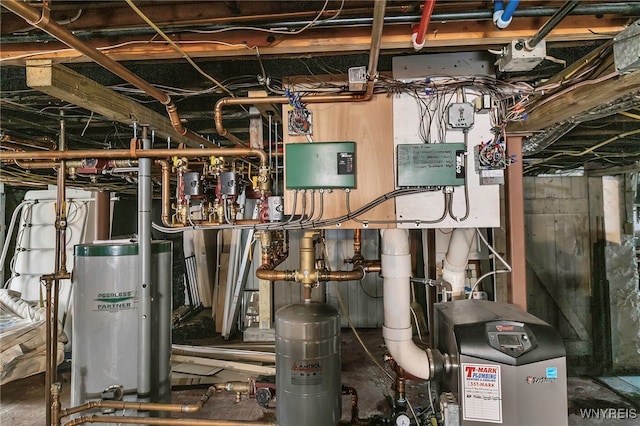 utility room with a heating unit and gas water heater