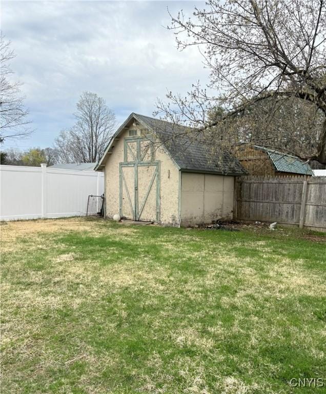view of shed featuring a fenced backyard