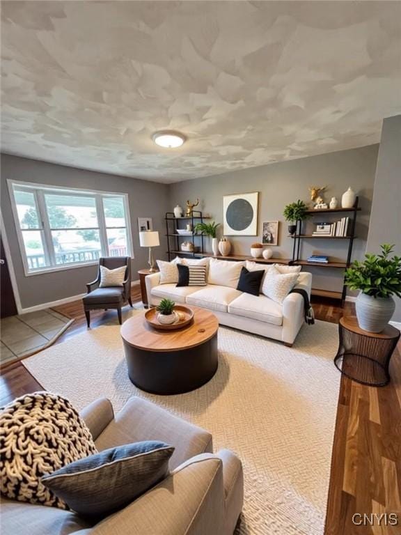 living room featuring wood finished floors and baseboards