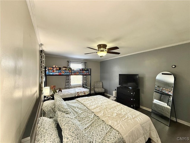 bedroom featuring baseboards, ornamental molding, and a ceiling fan