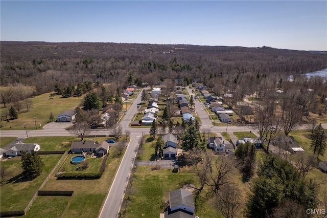 birds eye view of property featuring a residential view and a forest view