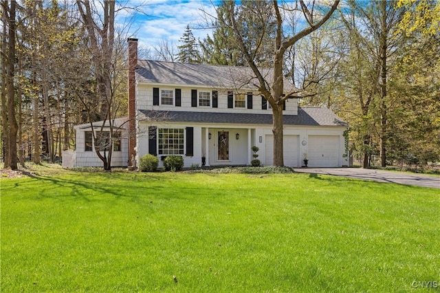 422 Salt Springs Rd, Manlius, NY 13066 - traditional-style home featuring a front yard, a shingled roof, a chimney, concrete driveway, and an attached garage