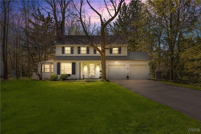 422 Salt Springs Rd, Manlius, NY 13066 - traditional home with a front lawn, driveway, a garage, and a chimney