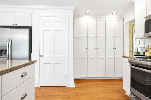 422 Salt Springs Rd, Manlius, NY 13066 - kitchen with appliances with stainless steel finishes, white cabinetry, and light wood finished floors