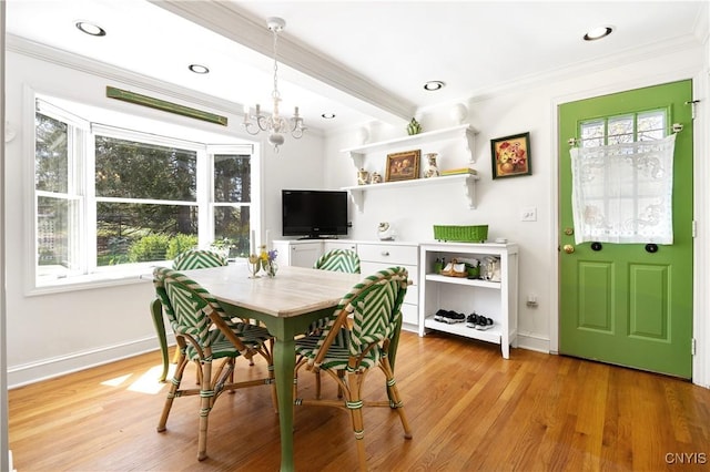 422 Salt Springs Rd, Manlius, NY 13066 - dining space with a chandelier, light wood-style floors, ornamental molding, and baseboards