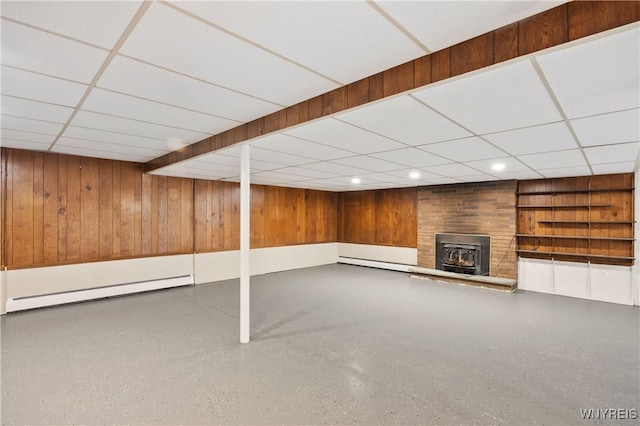 1631 Tuscarora Rd, Niagara, NY 14304 - finished basement with wooden walls, a fireplace, and a drop ceiling