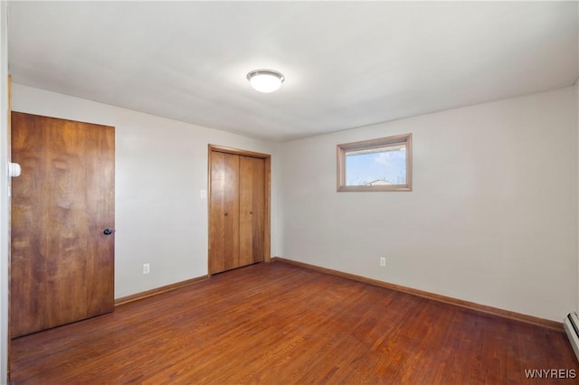 1631 Tuscarora Rd, Niagara, NY 14304 - unfurnished bedroom with a baseboard radiator, wood finished floors, and baseboards