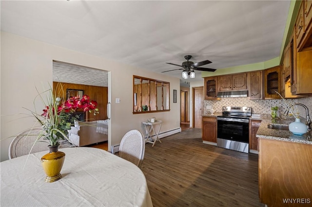 1631 Tuscarora Rd, Niagara, NY 14304 - kitchen featuring dark wood-style floors, a sink, under cabinet range hood, tasteful backsplash, and electric range