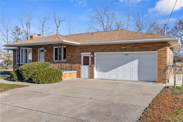 1631 Tuscarora Rd, Niagara, NY 14304 - single story home with a chimney, concrete driveway, an attached garage, and brick siding