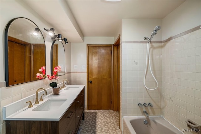 1631 Tuscarora Rd, Niagara, NY 14304 - bathroom with tile walls, tile patterned floors, shower / bathing tub combination, and a sink