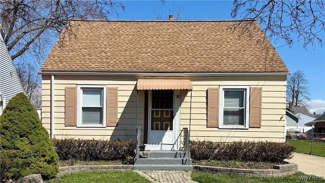 view of front of property with roof with shingles