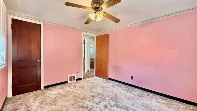 unfurnished bedroom featuring visible vents, ceiling fan, baseboards, and carpet floors