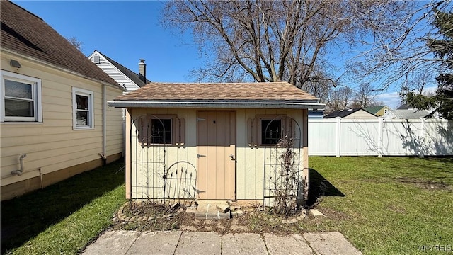 view of shed with fence