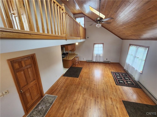 unfurnished living room with ceiling fan, light wood-style floors, high vaulted ceiling, and wooden ceiling