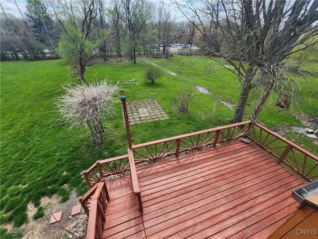 wooden terrace with a yard