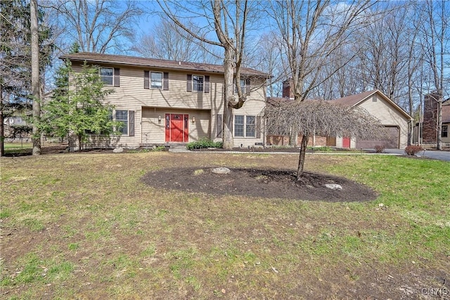 7266 Wakefield Dr, Manlius, NY 13066 - colonial inspired home with a front lawn, driveway, a garage, and a chimney
