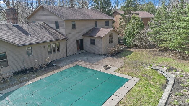 7266 Wakefield Dr, Manlius, NY 13066 - back of property featuring a covered pool and a patio area