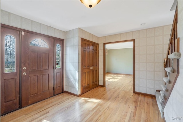 7266 Wakefield Dr, Manlius, NY 13066 - entrance foyer with baseboards, stairway, and light wood finished floors