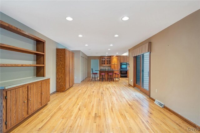 7266 Wakefield Dr, Manlius, NY 13066 - unfurnished living room featuring recessed lighting, visible vents, baseboards, and light wood-type flooring