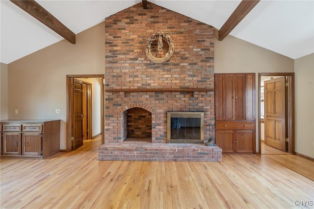 7266 Wakefield Dr, Manlius, NY 13066 - unfurnished living room featuring a fireplace, high vaulted ceiling, light wood finished floors, and beamed ceiling