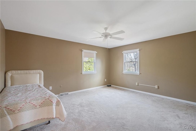 7266 Wakefield Dr, Manlius, NY 13066 - unfurnished bedroom featuring a ceiling fan, visible vents, carpet, and baseboards