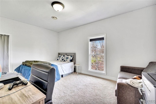 bedroom with carpet floors and baseboards