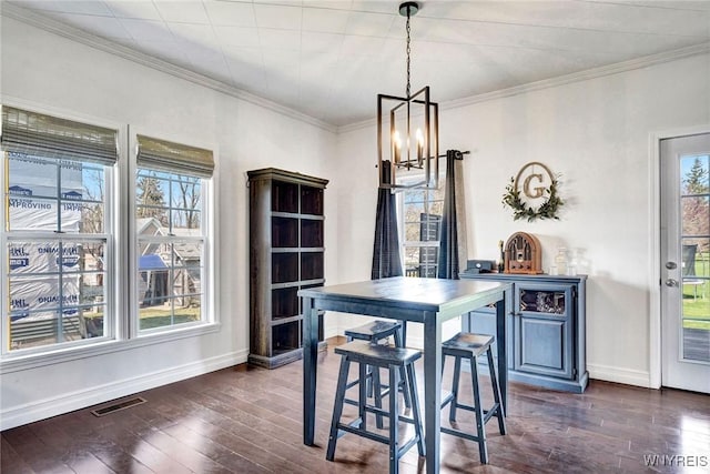 dining room featuring visible vents, baseboards, a notable chandelier, and dark wood finished floors