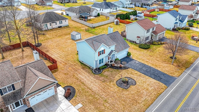 birds eye view of property with a residential view